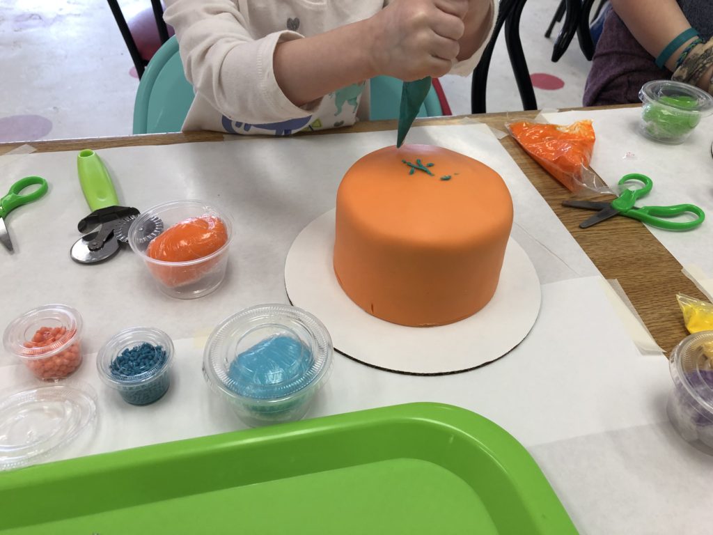 Decorating a cake at Jubilee Cake Studio